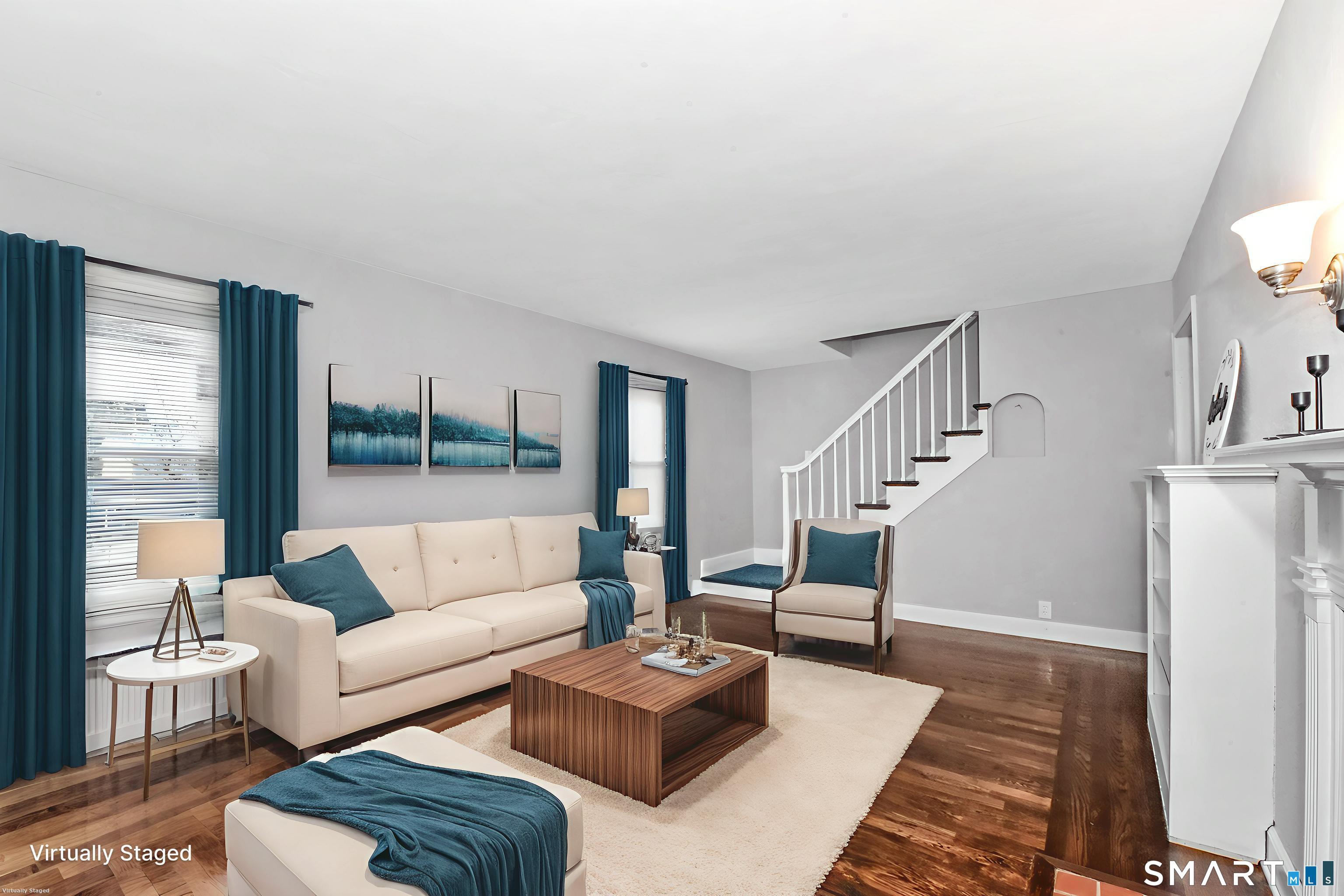 63 Park Road Hamden, CT 06517 - Photo 17 of 39 a living room with furniture and a table