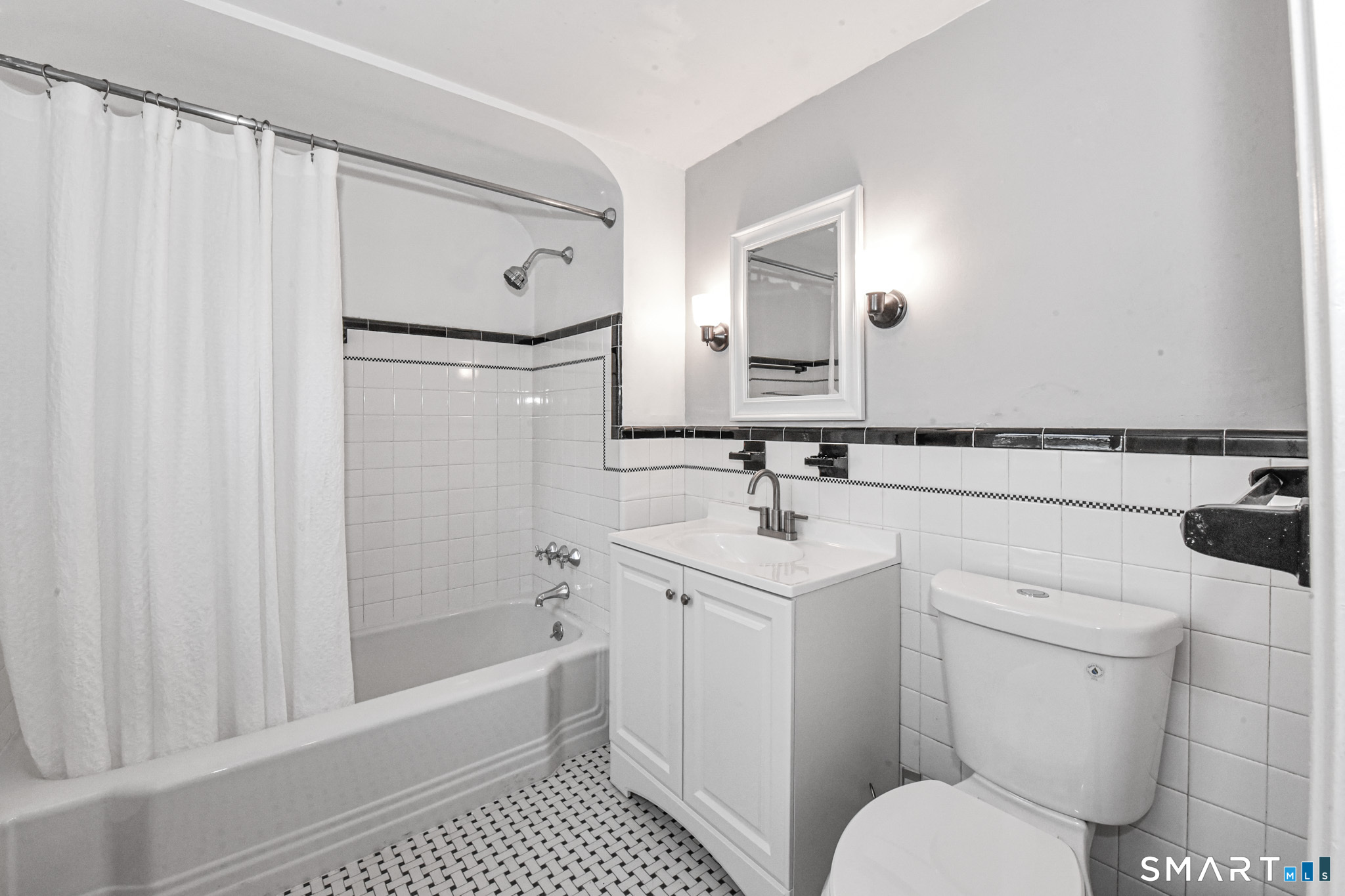 63 Park Road Hamden, CT 06517 - Photo 20 of 39 a bathroom with a sink toilet and shower