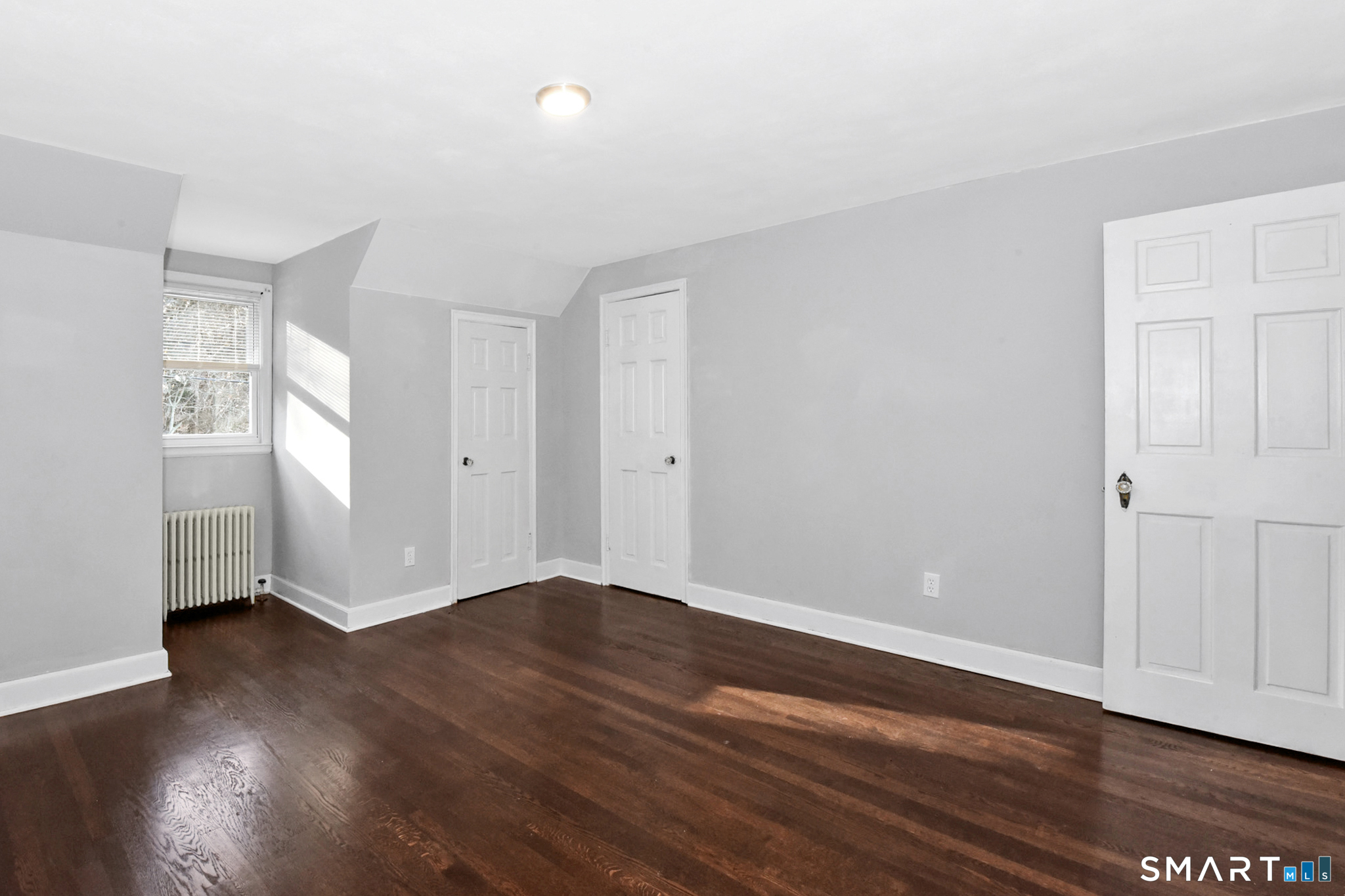 63 Park Road Hamden, CT 06517 - Photo 27 of 39 a view of an empty room with wooden floor