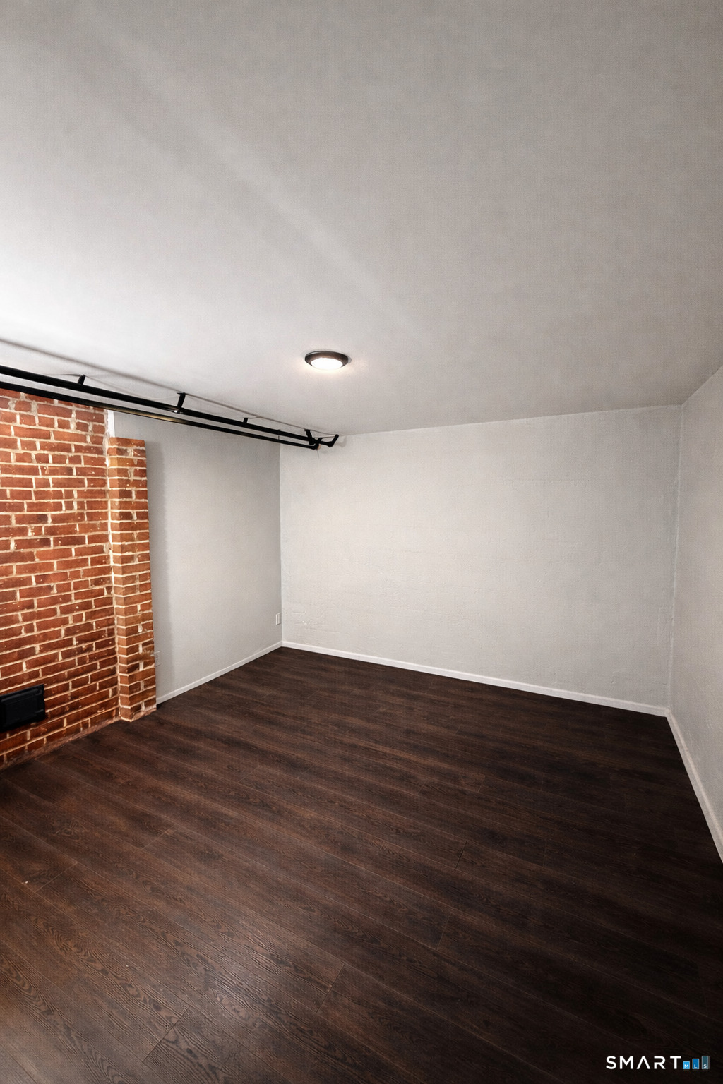 63 Park Road Hamden, CT 06517 - Photo 28 of 39 a view of an empty room with wooden floor and a window
