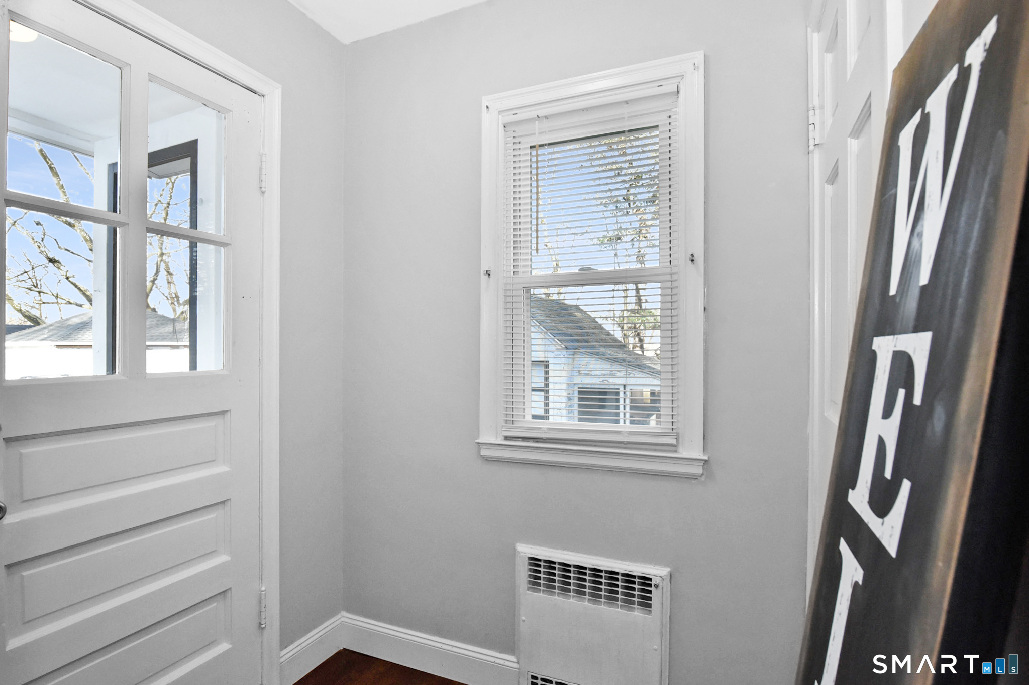 63 Park Road Hamden, CT 06517 - Photo 6 of 39 a view of an empty room with a window