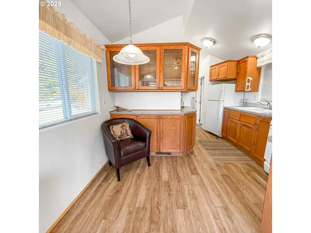a view of a house with a sink and wooden floor