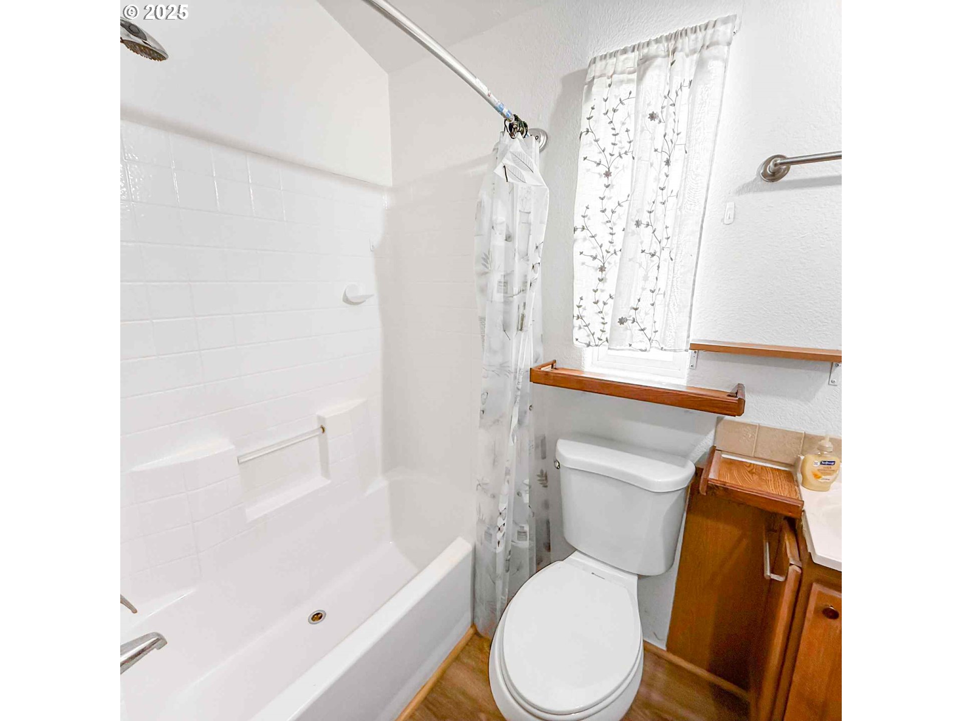 15061 Highway 101, Unit 4 Brookings, OR 97415 - Photo 13 of 19 a white toilet sitting next to a bath tub shower