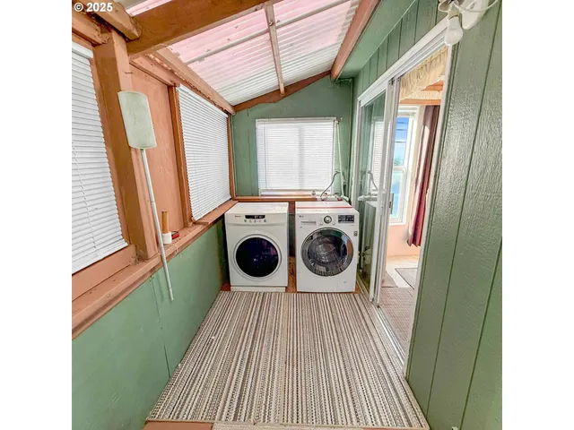 a view of a kitchen with a washer and dryer