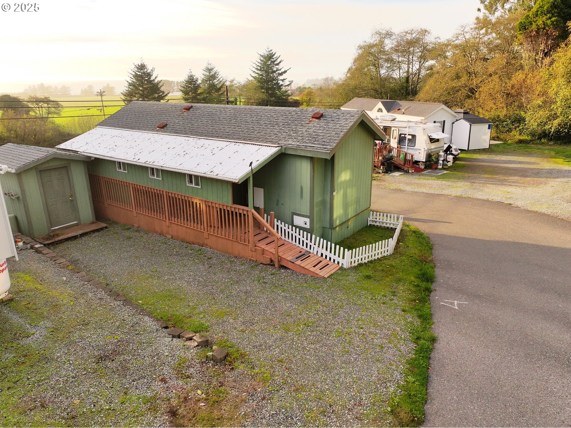 15061 Highway 101, Unit 4 Brookings, OR 97415 - Photo 6 of 19 a aerial view of a house with a yard and garage