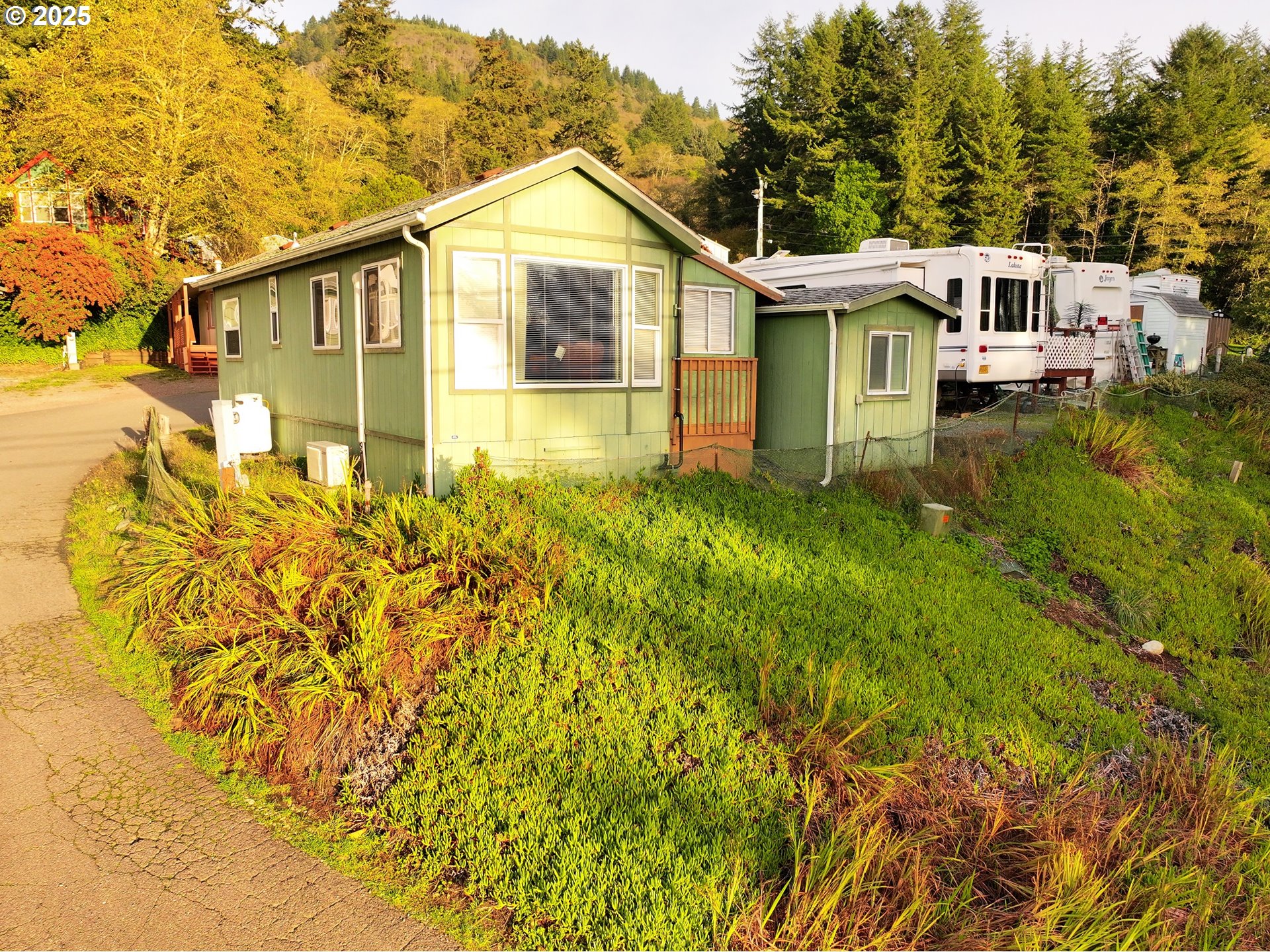 15061 Highway 101, Unit 4 Brookings, OR 97415 - Photo 8 of 19 a view of a house with a yard