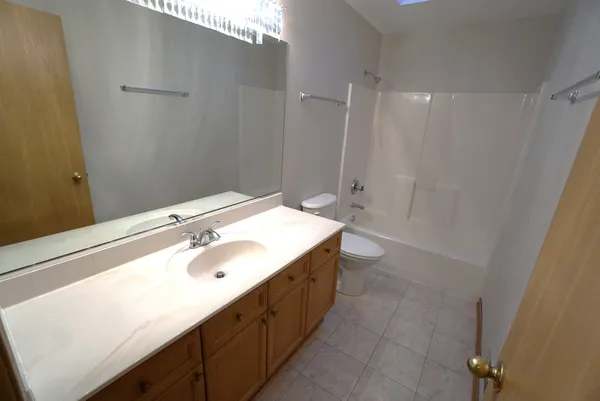 a view of a bathroom with wooden floor and staircase