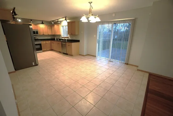 a large kitchen with cabinets