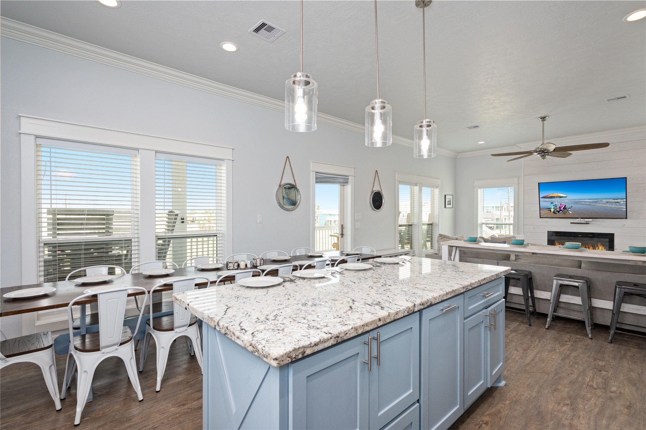997 South Redfish Crystal Beach, TX 77650 - Photo 12 of 45 a kitchen with center island table and chairs