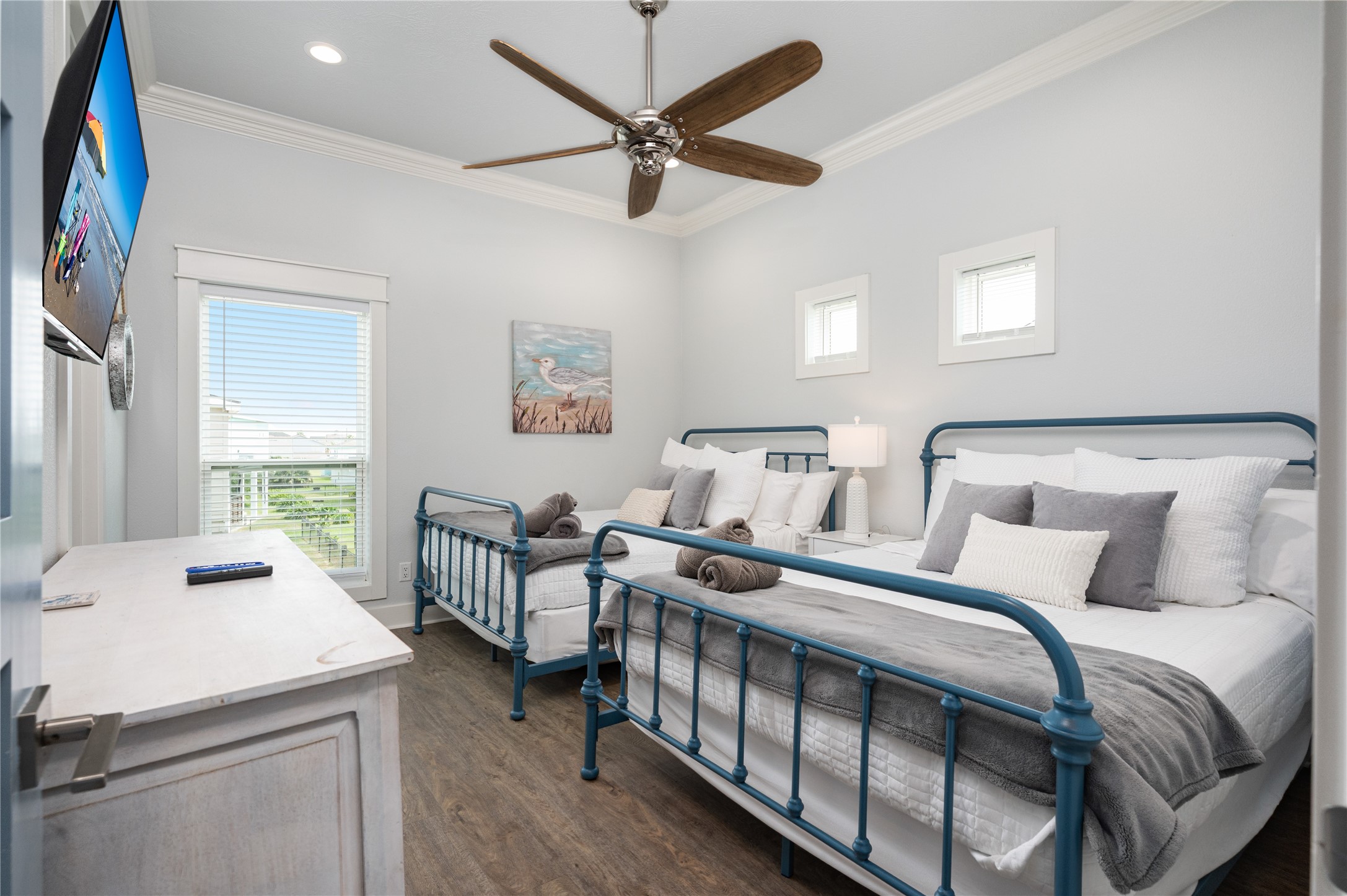997 South Redfish Crystal Beach, TX 77650 - Photo 16 of 45 a bedroom with a bed and a chandelier