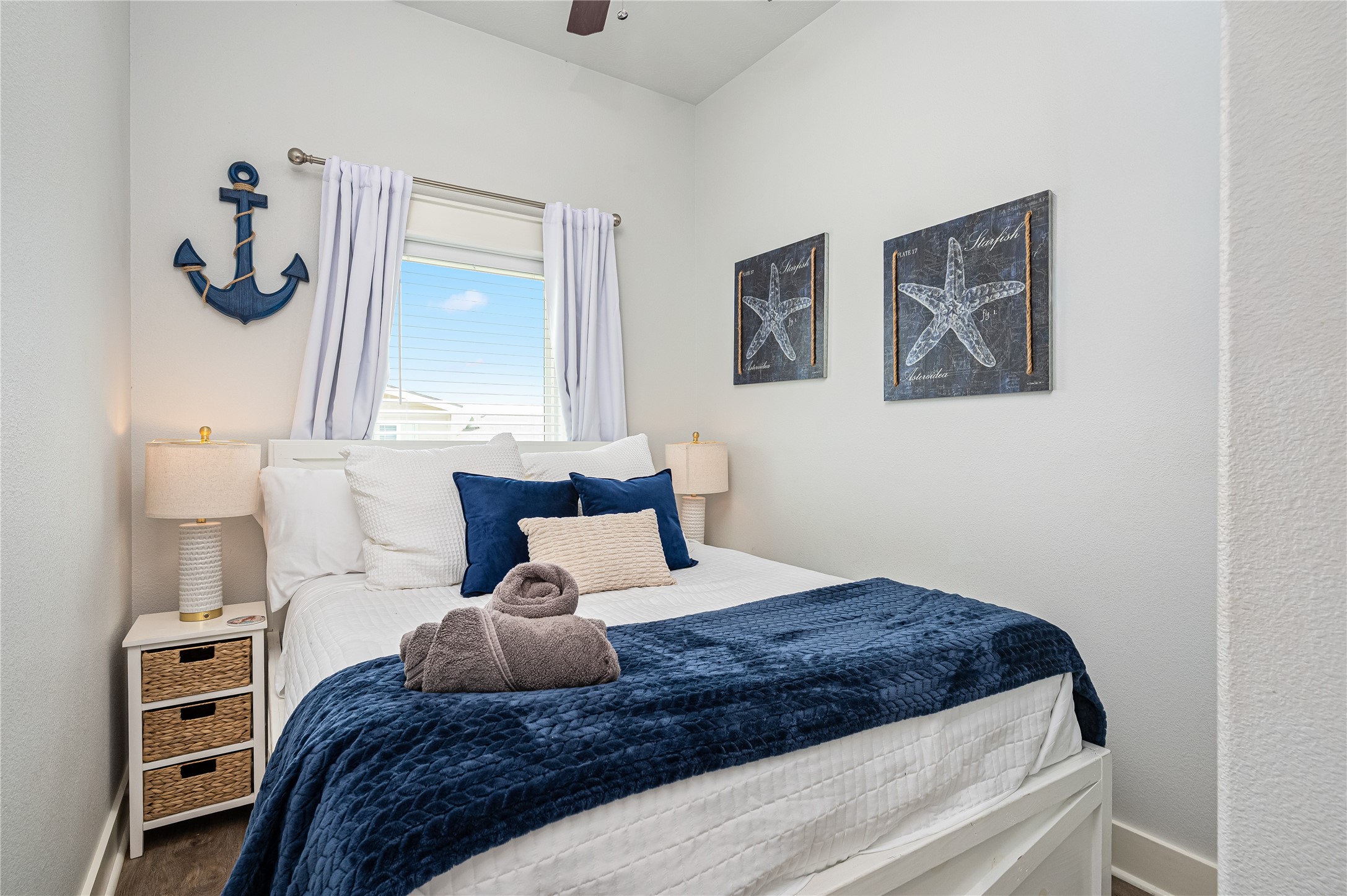 997 South Redfish Crystal Beach, TX 77650 - Photo 23 of 45 a bedroom with a large bed and a dresser