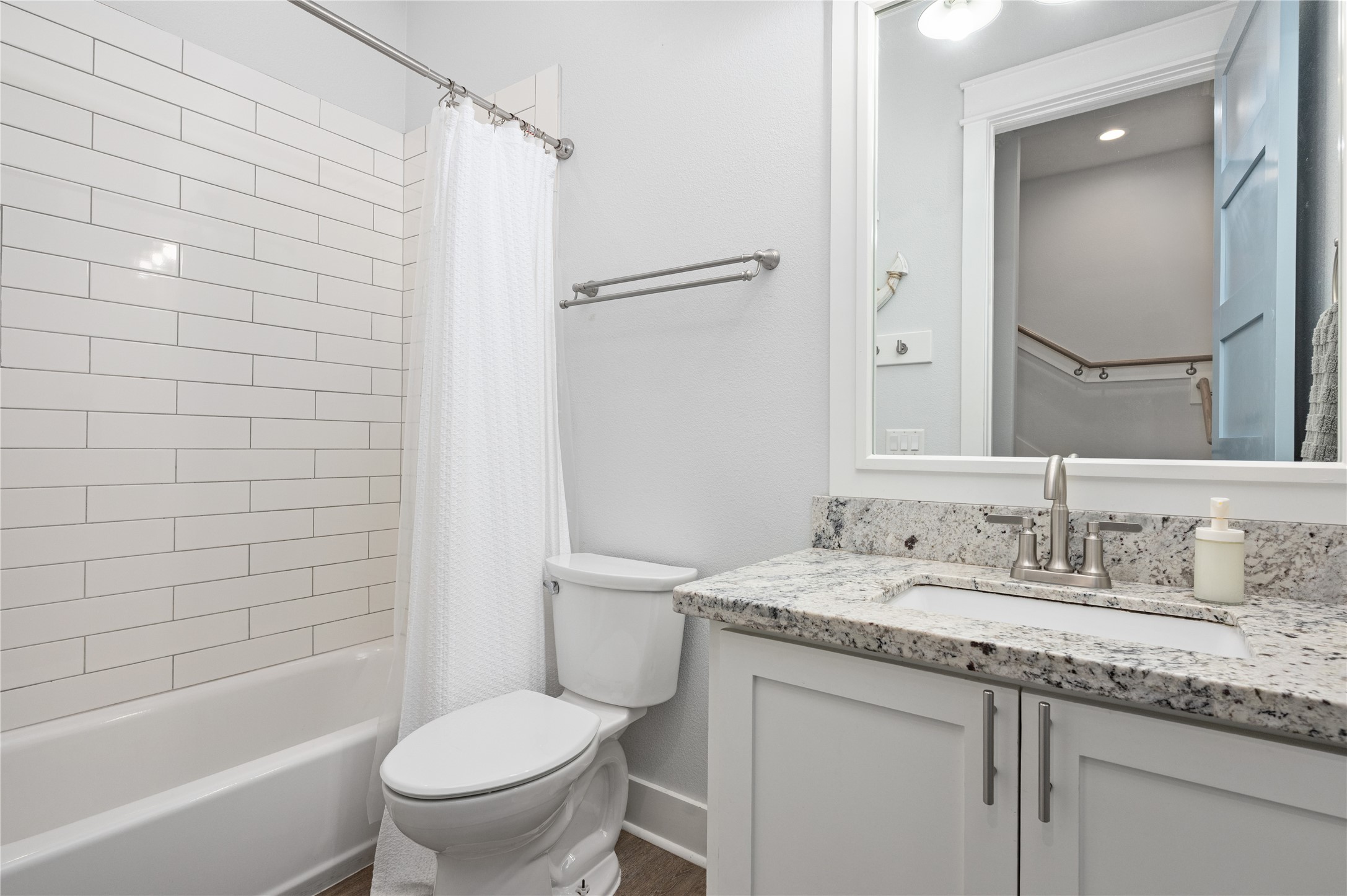 997 South Redfish Crystal Beach, TX 77650 - Photo 25 of 45 a bathroom with a granite countertop sink toilet and shower