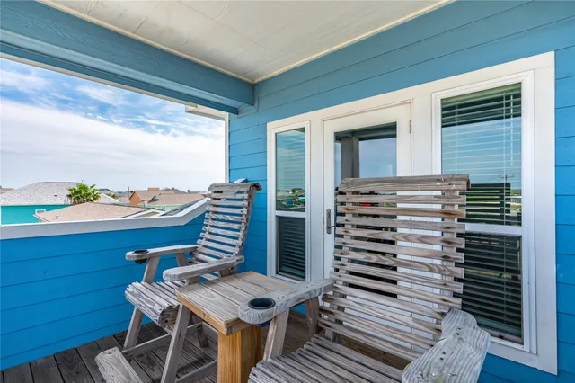 a balcony view with a seating space