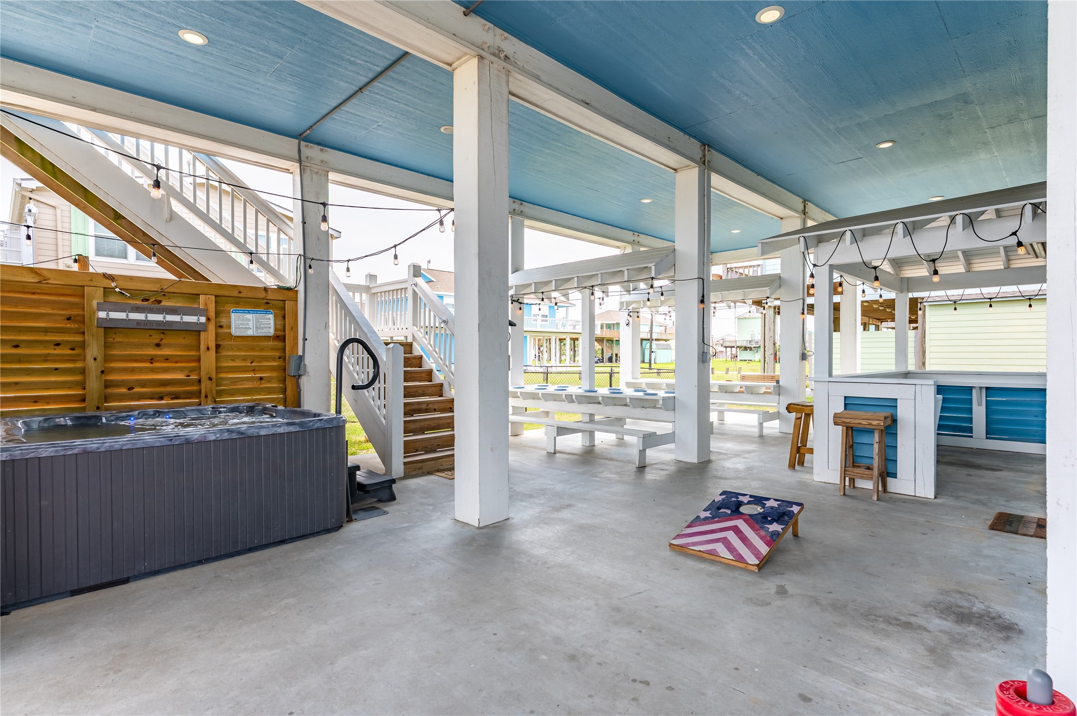 997 South Redfish Crystal Beach, TX 77650 - Photo 4 of 45 a living room with furniture and a floor to ceiling window