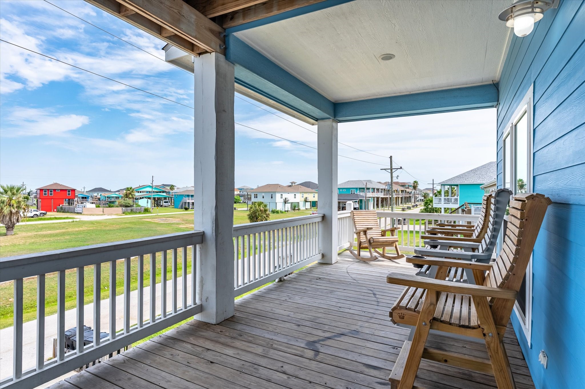 997 South Redfish Crystal Beach, TX 77650 - Photo 7 of 45 a view of a balcony with wooden floor