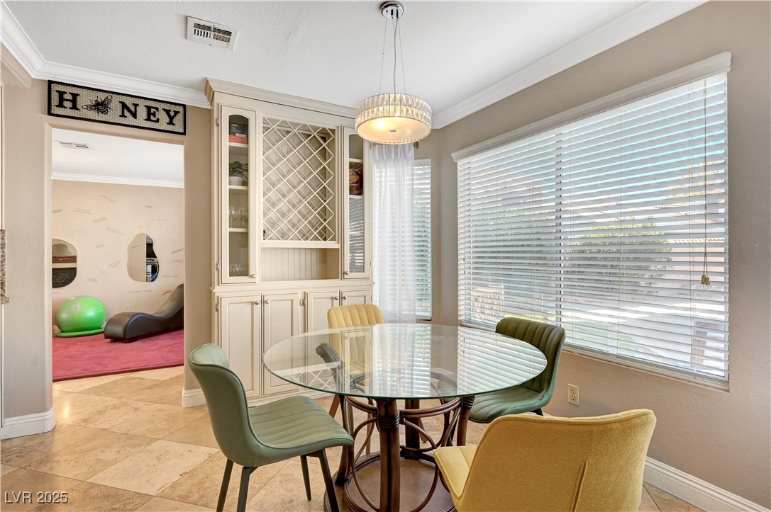 1486 Powder Horn Drive Henderson, NV 89014 - Photo 18 of 99 Dining area with crown molding