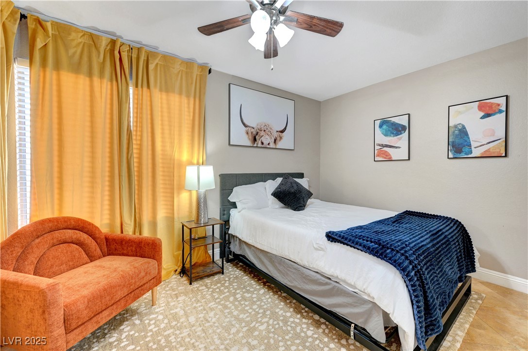 1486 Powder Horn Drive Henderson, NV 89014 - Photo 41 of 99 Bedroom featuring ceiling fan and baseboards