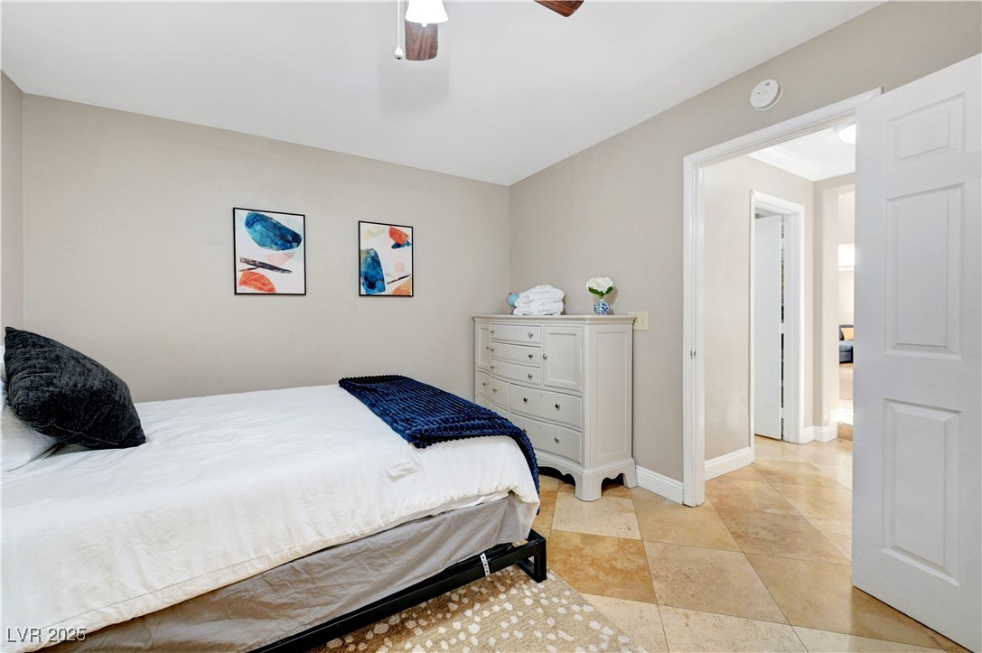 1486 Powder Horn Drive Henderson, NV 89014 - Photo 44 of 99 Bedroom with baseboards and ceiling fan