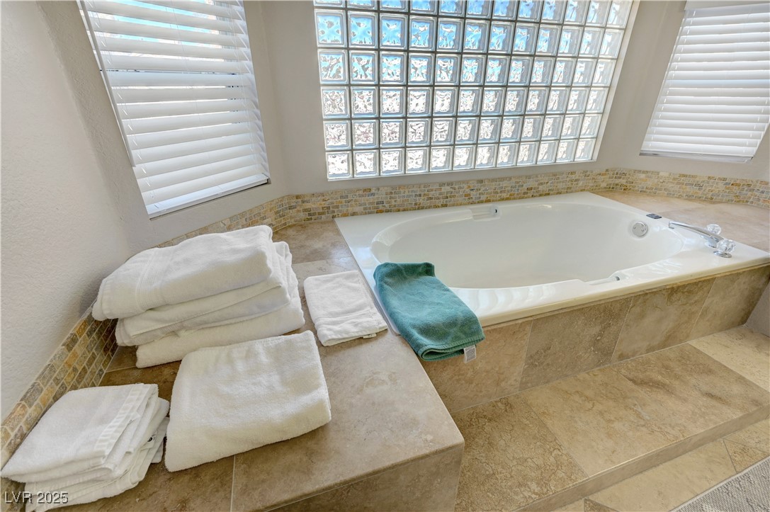 1486 Powder Horn Drive Henderson, NV 89014 - Photo 57 of 99 Bathroom with a bath and tile patterned flooring