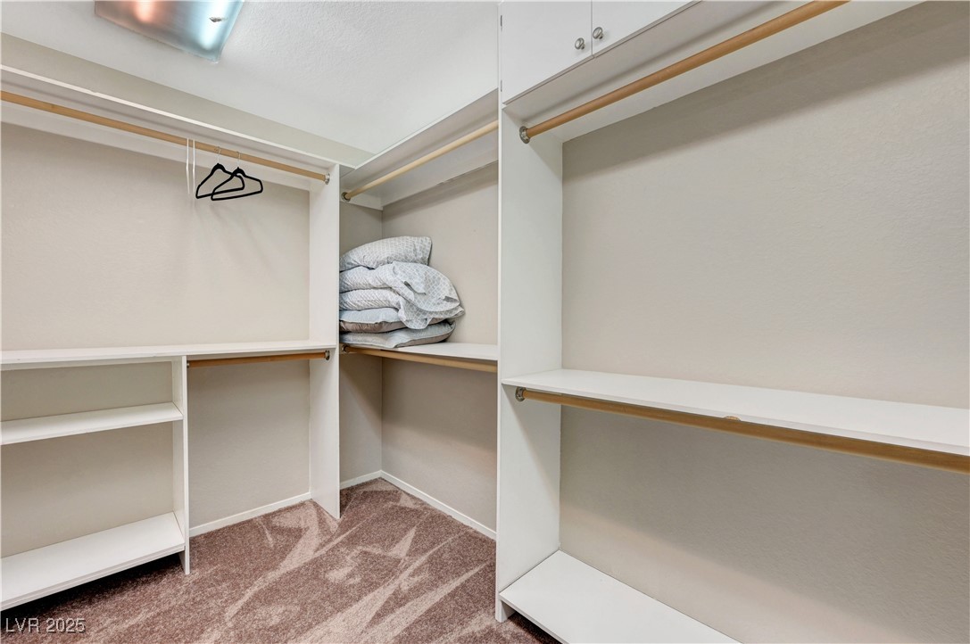 1486 Powder Horn Drive Henderson, NV 89014 - Photo 58 of 99 Walk in closet with light colored carpet