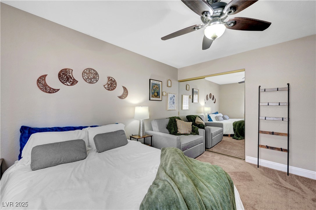 1486 Powder Horn Drive Henderson, NV 89014 - Photo 63 of 99 Bedroom featuring light colored carpet, a ceiling fan, and a closet
