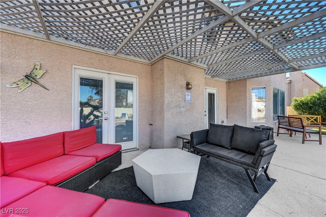 1486 Powder Horn Drive Henderson, NV 89014 - Photo 84 of 99 View of patio / terrace with an outdoor hangout area and a pergola