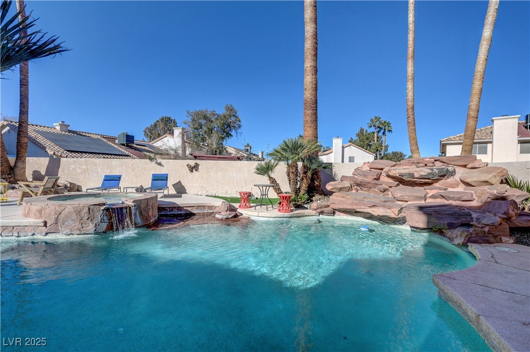 1486 Powder Horn Drive Henderson, NV 89014 - Photo 86 of 99 View of swimming pool featuring a patio, a fenced backyard, and a pool with connected hot tub