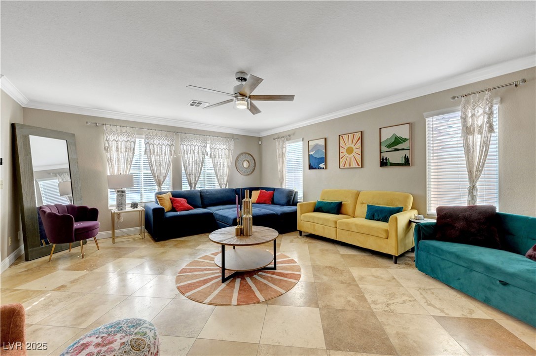 1486 Powder Horn Drive Henderson, NV 89014 - Photo 9 of 99 Living room with crown molding, plenty of natural light, and ceiling fan