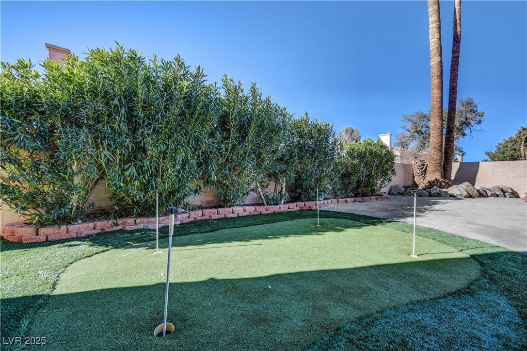 1486 Powder Horn Drive Henderson, NV 89014 - Photo 88 of 99 View of home's community featuring an area to practice putting and a fenced backyard