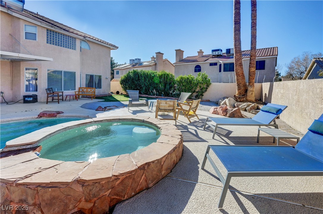 1486 Powder Horn Drive Henderson, NV 89014 - Photo 92 of 99 View of pool with a patio area and an in-ground hot tub