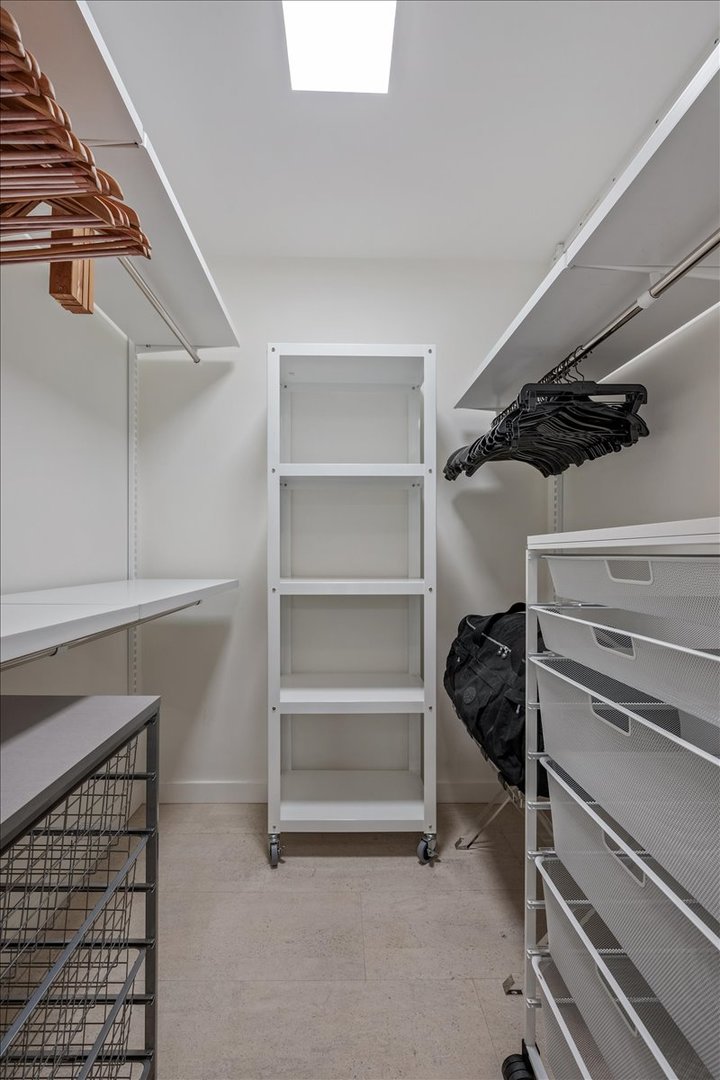 360 East Randolph Street, Unit 1002 Chicago, IL 60601 - Photo 19 of 27 a view of walk in closet with empty racks