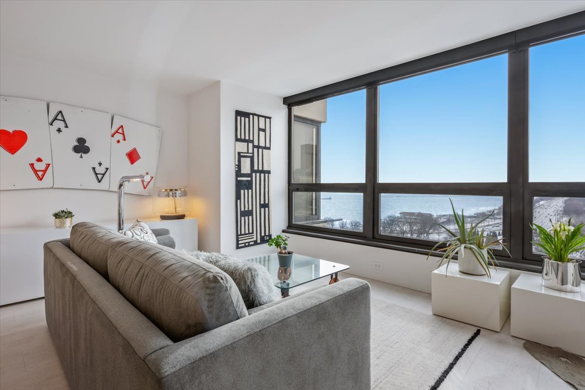 360 East Randolph Street, Unit 1002 Chicago, IL 60601 - Photo 10 of 27 a living room with furniture and a large window