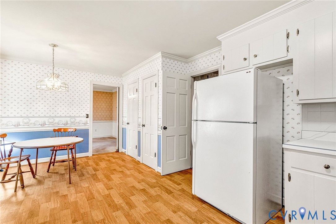 2820 Euphoria Road Chester, VA 23831 - Photo 14 of 38 Kitchen with wallpapered walls, freestanding refri