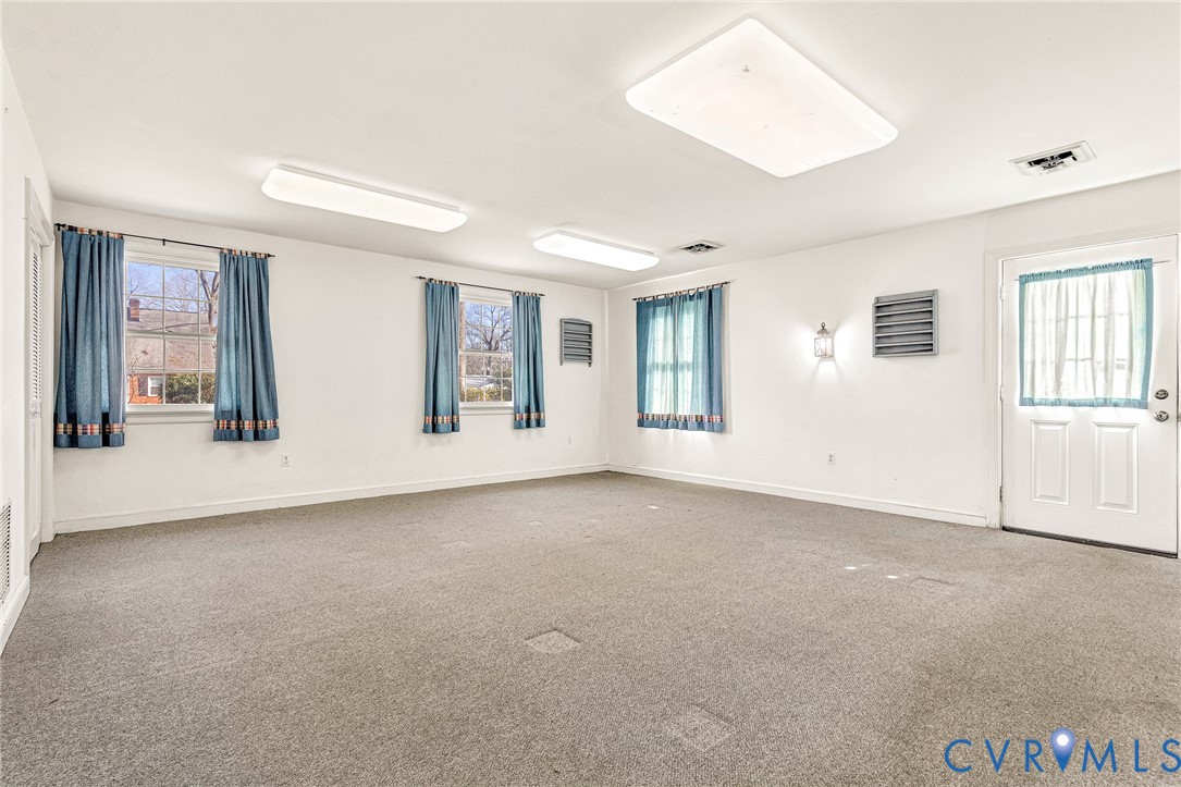 2820 Euphoria Road Chester, VA 23831 - Photo 24 of 38 Empty room with carpet and plenty of natural light