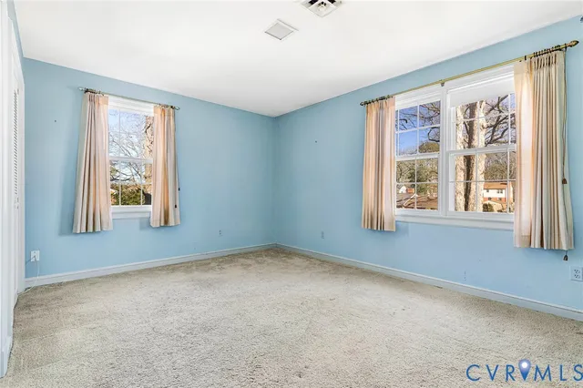 a view of a room with window and stairs