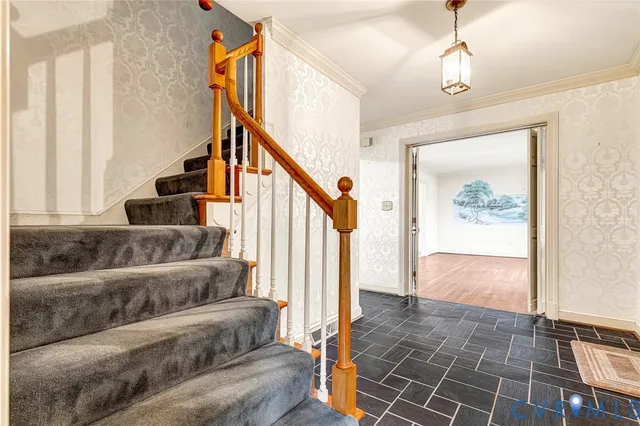 a view of entryway and hall with wooden floor