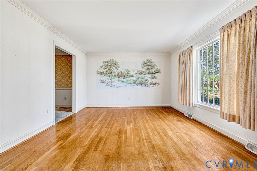 2820 Euphoria Road Chester, VA 23831 - Photo 7 of 38 Empty room with wallpapered walls, light wood fini