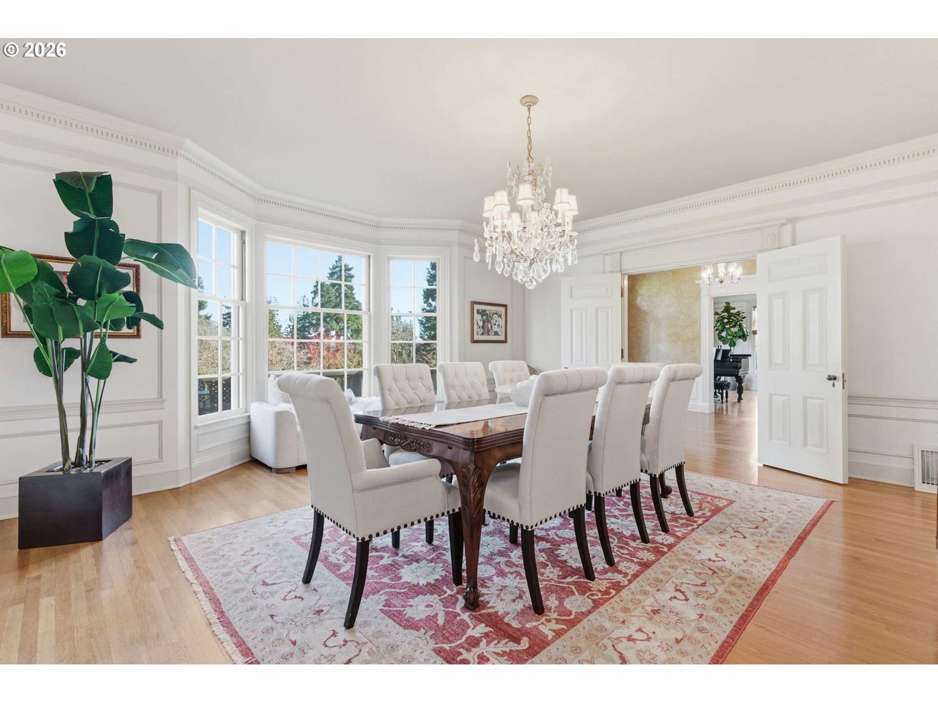 2393 South Military Road Portland, OR 97219 - Photo 11 of 48 a dining room with furniture potted plants and wooden floor