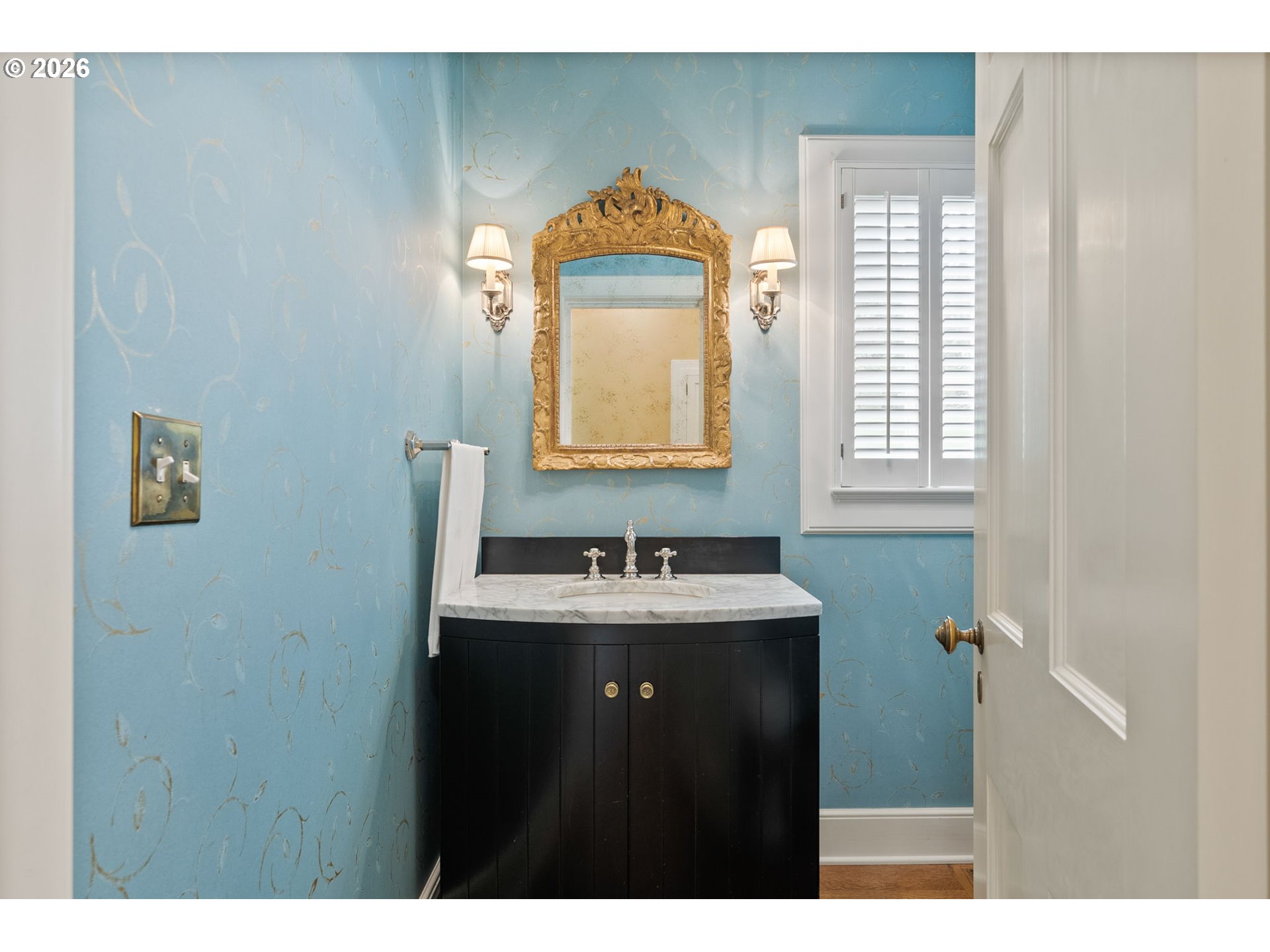 2393 South Military Road Portland, OR 97219 - Photo 19 of 48 a bathroom with a sink and a mirror