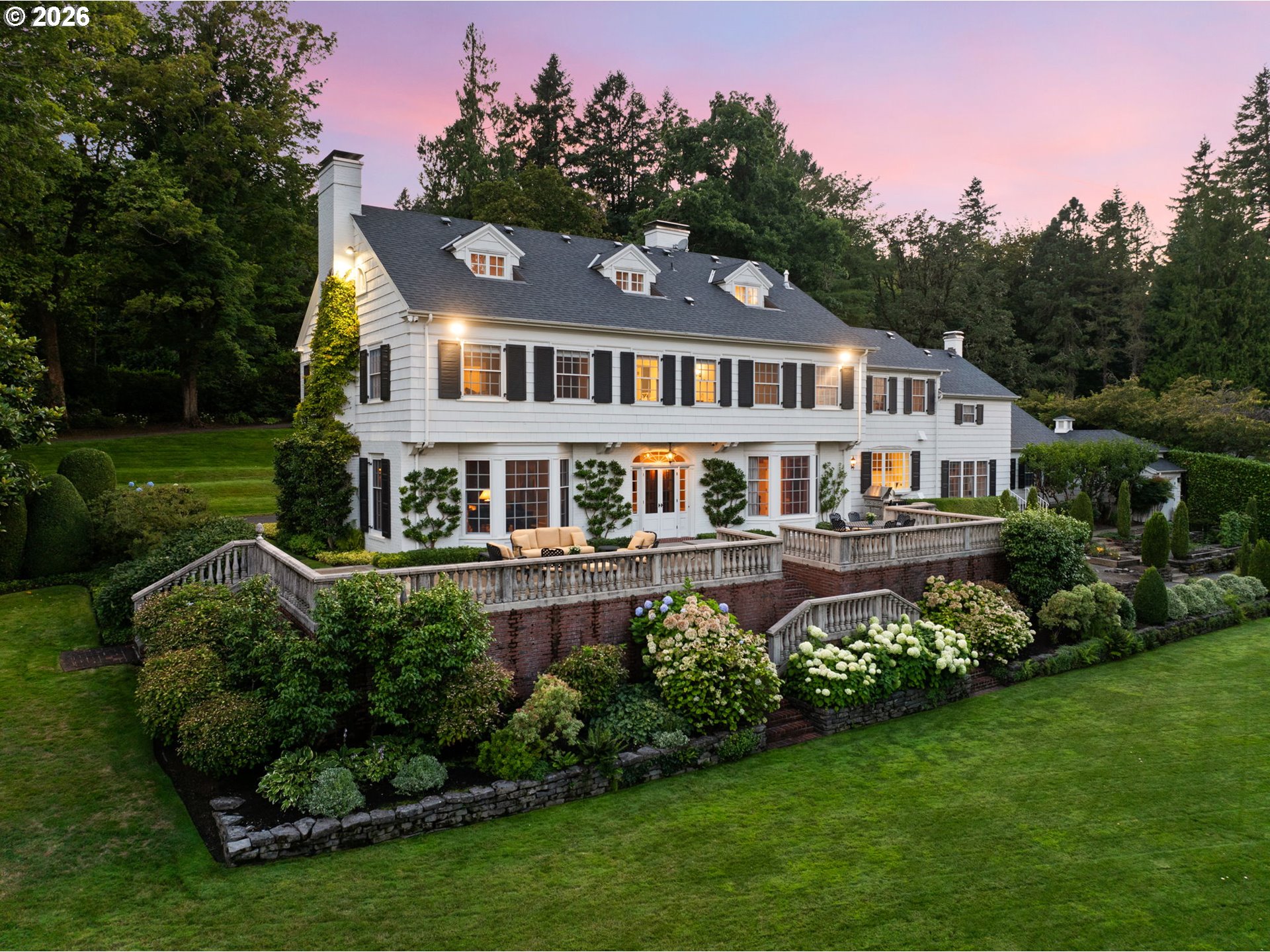 2393 South Military Road Portland, OR 97219 - Photo 2 of 48 a front view of a house with a garden