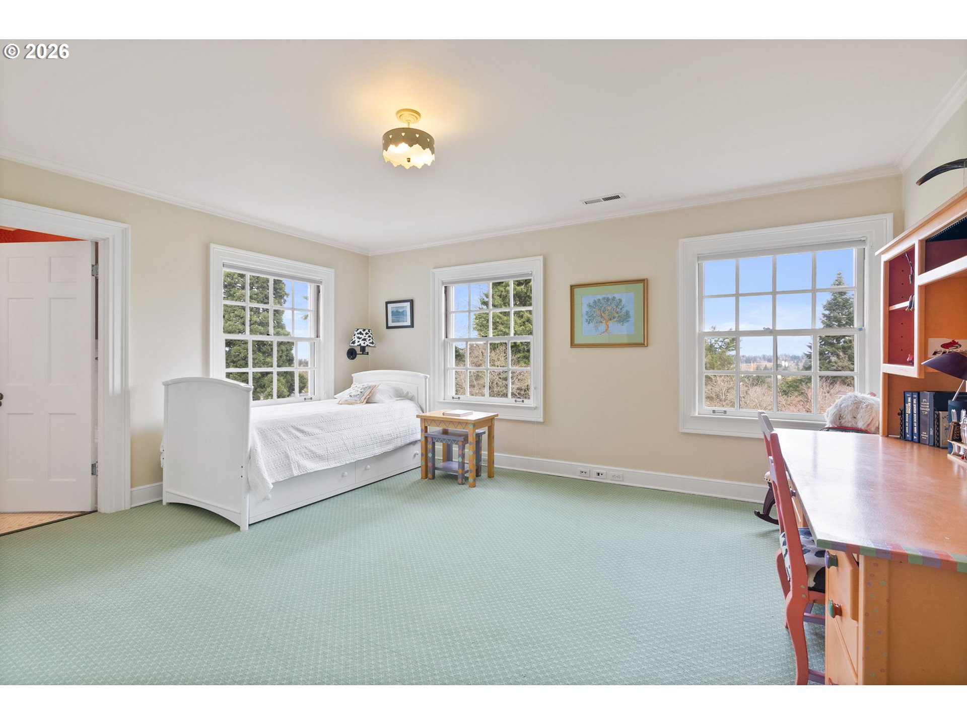 2393 South Military Road Portland, OR 97219 - Photo 27 of 48 a spacious bedroom with a bed and a couch