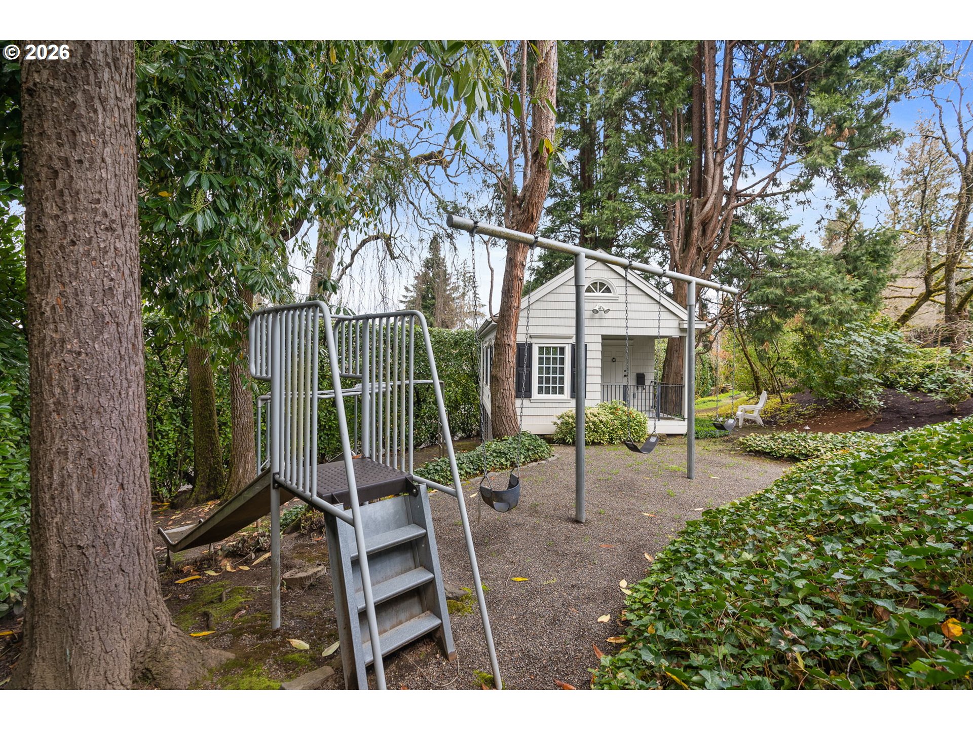 2393 South Military Road Portland, OR 97219 - Photo 40 of 48 a view of a house with backyard and a sitting area