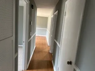 a view of gallery with wooden floor