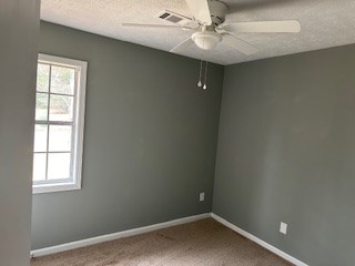 6229 Potomac Circle Columbus, GA 31909 - Photo 8 of 14 an empty room with a window and a fan