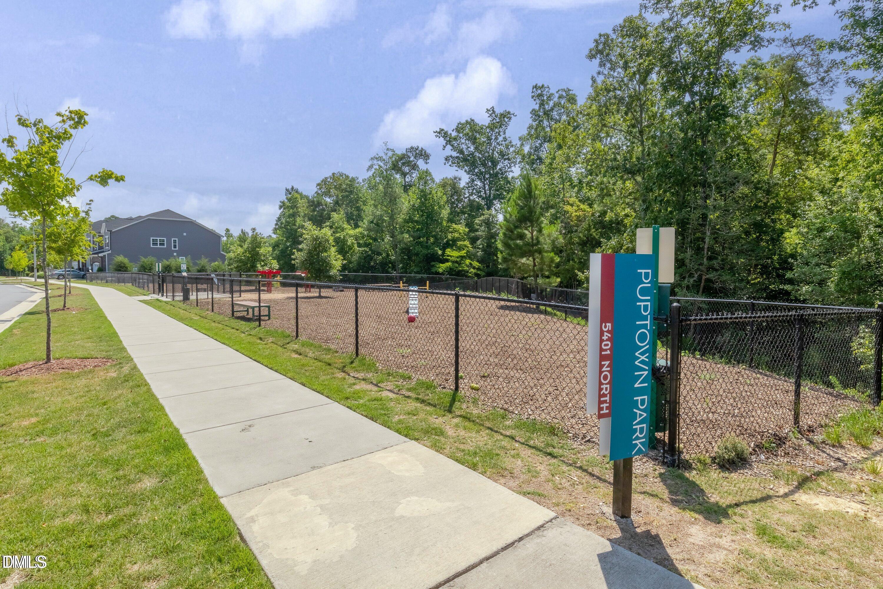 5916 Giddings Street Raleigh, NC 27616 - Photo 40 of 49 a view of a pathway with a wrought fence