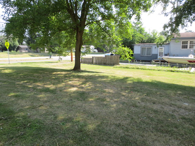 26211 West Rollins Road Ingleside, IL 60041 - Photo 2 of 16 a view of a house with a yard and tree s