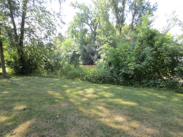 26211 West Rollins Road Ingleside, IL 60041 - Photo 10 of 16 a view of a field with trees in the background