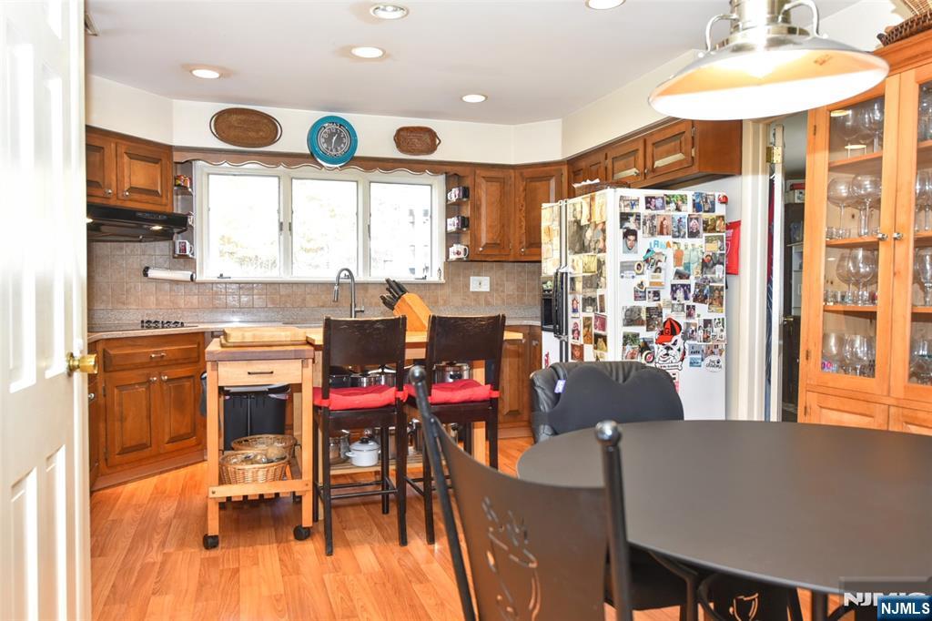 951 Berdan Avenue Wayne, NJ 07470 - Photo 11 of 39 a view of a dining room with furniture and wooden floor