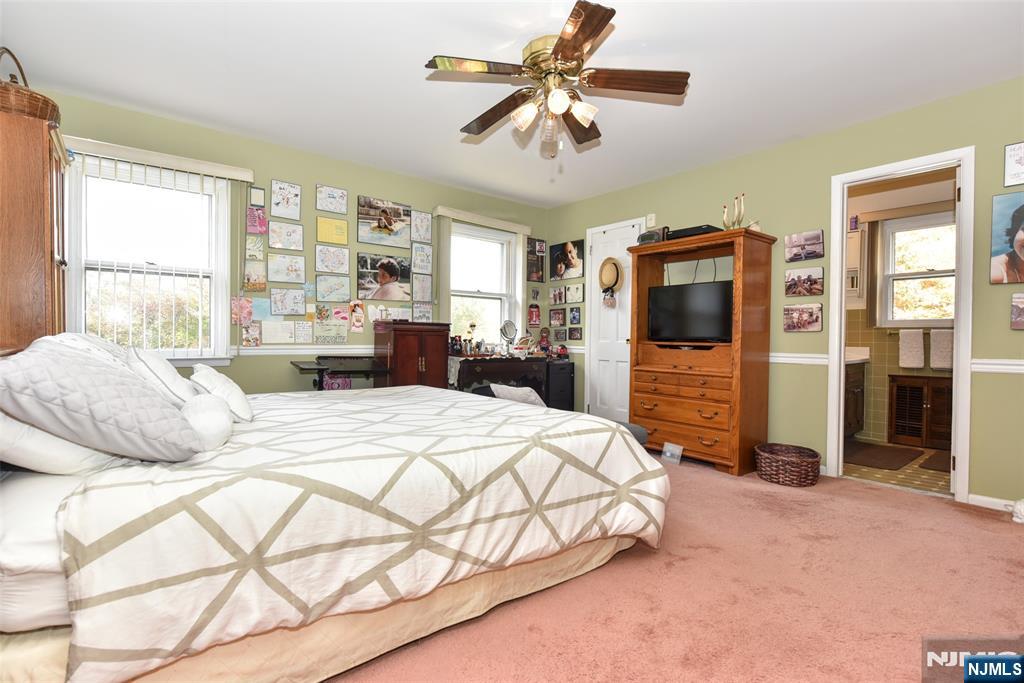951 Berdan Avenue Wayne, NJ 07470 - Photo 15 of 39 a bedroom with a bed dresser and a large window