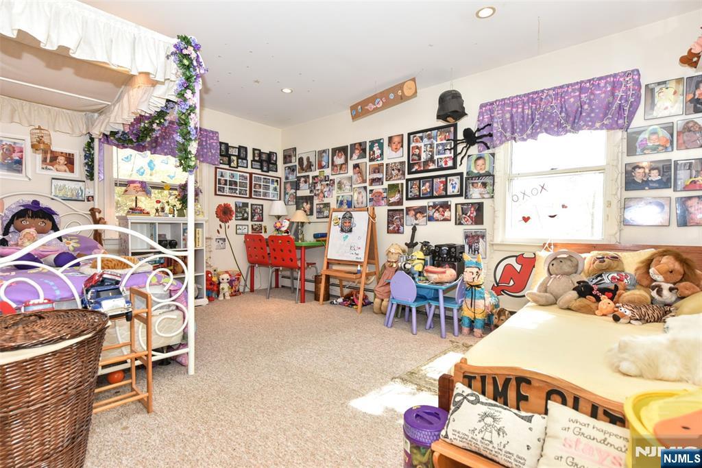 951 Berdan Avenue Wayne, NJ 07470 - Photo 19 of 39 a living room with lots of furniture and white walls